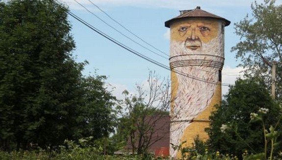 russian street artist raises 08 in Super Cool Building Graffiti Revive Old Buildings